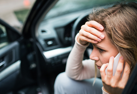 Person on the phone after car accident